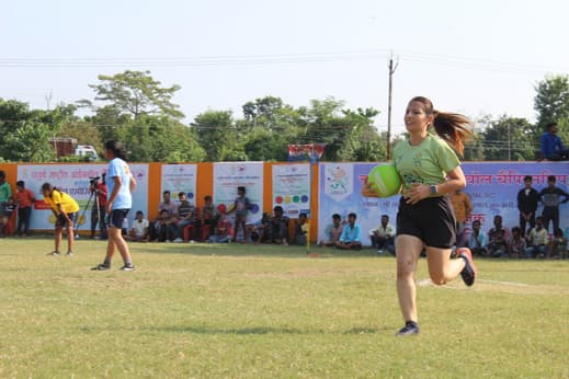 Runner mid-race at a grassroots athletics meet