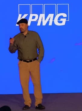 Speaker session on stage at a KPMG corporate event
