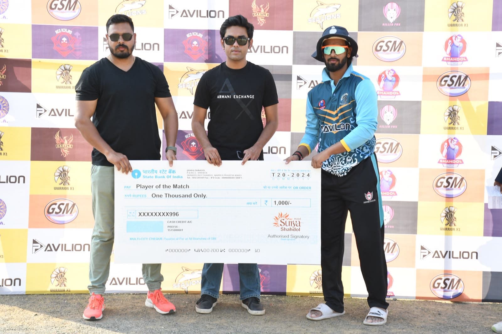 Player of the match cheque presentation with officials