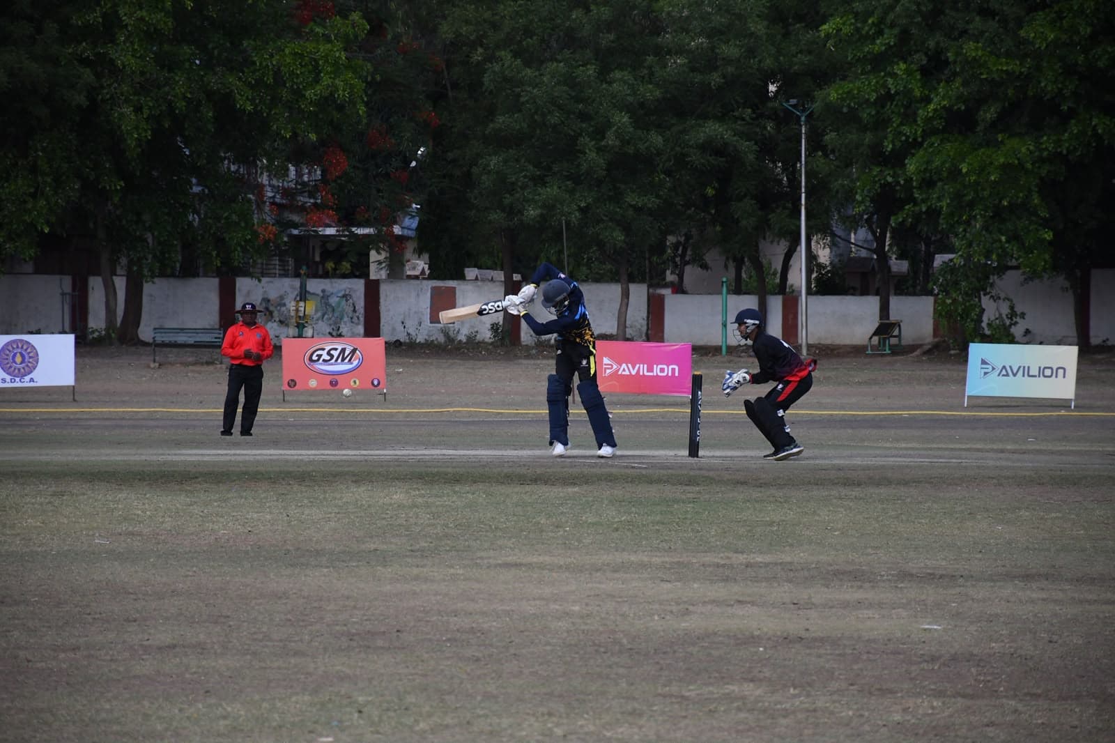 Batter mid-shot at an Avilion-branded league fixture