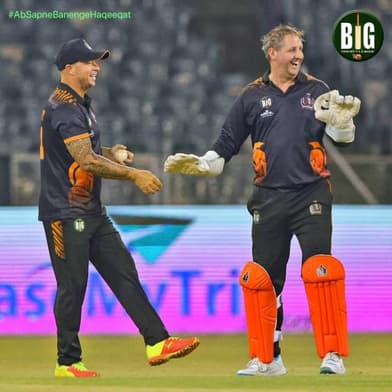 BIG Cricket League players walking out to bat
