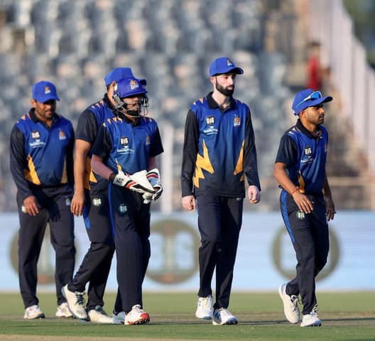 Teams walking out for a BIG Cricket League match