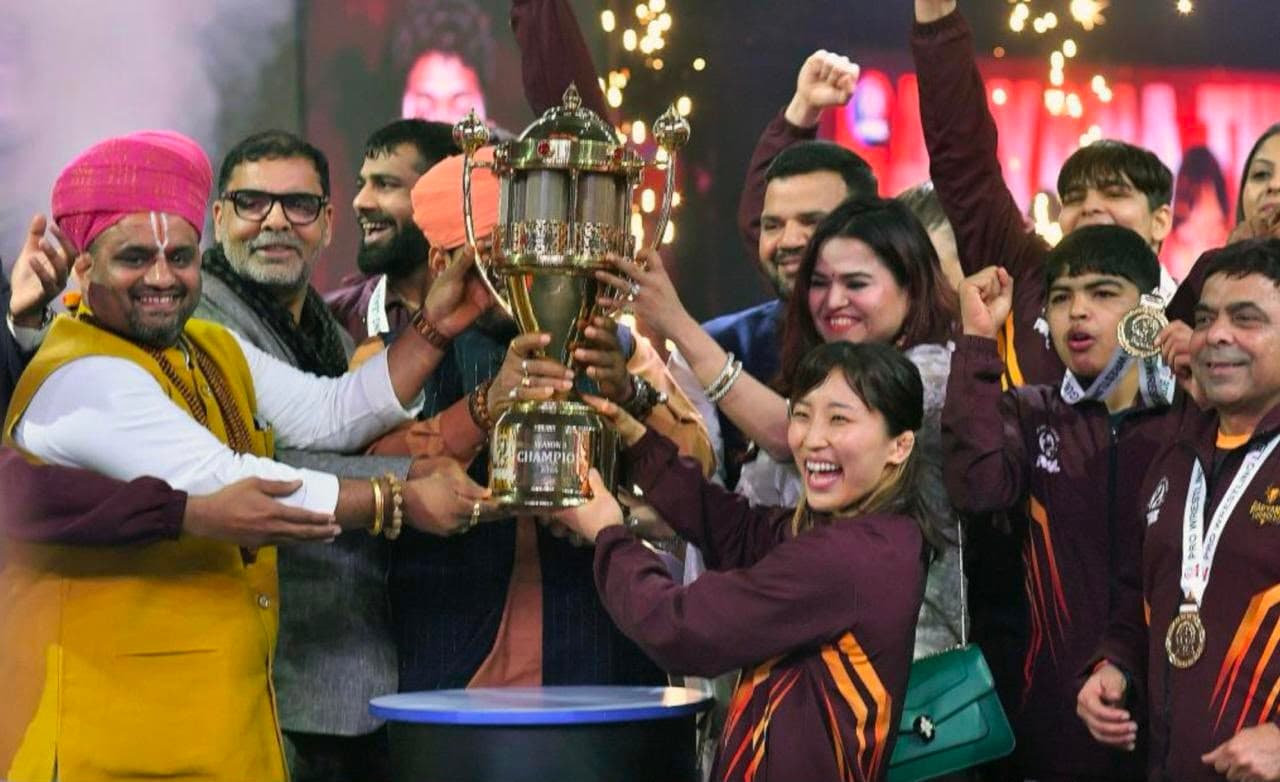 Pro Wrestling League team lifting the champions trophy amid confetti